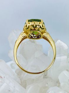 Natural Peridot Ring/ Yellow Gold Plated Sterling Silver/ - Etsy Vintage Green Jewelry With Halo Setting, Yellow Gold Peridot Jewelry With Halo Setting, Green Round Cut Heirloom Jewelry, Green Oval Heirloom Jewelry, Heirloom Oval Green Jewelry, Green Heirloom Round Cut Jewelry, Heirloom Green Round Cut Jewelry, Heirloom Green Oval Jewelry, Peridot Center Stone Yellow Gold Jewelry