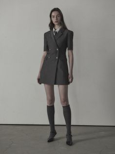 The slim fit jacket dress that made of lightweight spring fabric. Featuring the double-breasted closure with black-silver toned buttons, and its slim silhouette and mini length. We recommend style with shirts or scarf to create unique school look. - Notched lapel collar and half-sleeved design- Double-breasted closure- Black-silver buttons detail- Flap pockets and seam line detail at front- Slim and fitted silhouette, mini length- Lightweight polyester fabric for spring- Renewed slim fit version of previous 'Jenn Suit Jacket Dress' Fitted Short Sleeve Business Blazer, Fitted Short Sleeve Blazer For Business, Fitted Double-breasted Mini Dress With Button Closure, Classic Fitted Dress With Double Button Closure, Classic Tailored Jacket Dress For Spring, Fitted Blazer Dress With Suit Collar For Career, Spring Fitted Mini Dress With Double Button Closure, Formal Fitted Mini Dress With Double Button Closure, Fitted Mini Dress With Double Button Closure For Spring