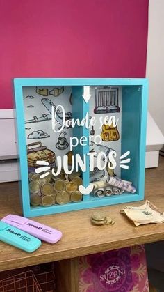 a wooden table topped with lots of different types of coins and magnets on top of it