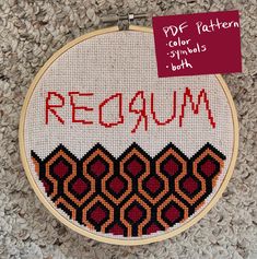 a cross stitch pattern with the word recaum written on it