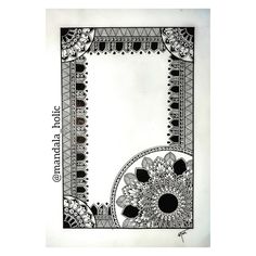 an intricately designed paper with black and white designs on the border, in front of a