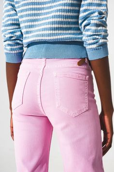 Add a pop of color to your casual ensemble with our Cropped Wide Leg Jeans in Bubblegum Pink. Made from a durable blend of 94% Cotton, 5% Polyester, and 1% Elastane, these jeans are designed for comfort and long-lasting wear. The model, who is 5'11'' tall and has measurements of 32-24-34, is wearing a size S and finds the jeans run true to size. The regular fit and high waist rise make them flattering on any body shape. These jeans feature a modern, wide-leg cut and fall to an ankle length for a Mid-rise Pink Flare Jeans With Five Pockets, Trendy Straight Fit Bottoms For Summer, Trendy Cropped Wide Leg Cotton Pants, Trendy Straight Fit Bottoms For Spring, Trendy Wide Leg Straight Fit Bottoms, Pink High Rise Flare Jeans For Fall, Pink Mid-rise Jeans For Fall, Pink Wide Leg Jeans With Five Pockets, High-waist Pink Jeans With Five Pockets