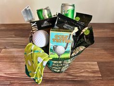 a golf gift basket is shown on a table