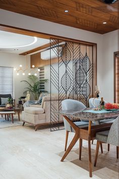 the dining room table is surrounded by chairs and tables with glass doors on each side