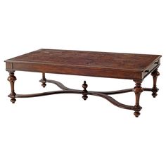 a wooden table with two legs and an ornate design on the top, against a white background