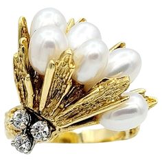 Ring Size: 6 This dazzling diamond and white cultured pearl cluster cocktail ring in 18-karat yellow gold is an exquisite statement piece to add to your fine jewelry collection. The ring boasts a bouquet of lustrous white cultured drop-shaped pearls gracefully nestled in a captivating setting of luxurious yellow gold. Complementing the pearls, three round brilliant cut diamonds shine brilliantly below, adding an enchanting touch to the overall design. The diamonds boast a total carat weight of 0 Luxury White Gold Cluster Ring Fine Jewelry, Luxury Yellow Gold Pearl Drop Ring, Luxury Yellow Gold Pearl Ring With Brilliant Cut, Luxury White Cluster Pearl Ring, Gold For Sale, Pearl Cluster, Pearl Types, Fine Jewelry Collection, Gold Pearl