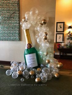 a bottle of champagne surrounded by bubbles in a room