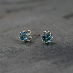 Faceted London Blue Topaz Stud Earrings Lovely blue gemstones prong set in sterling silver. 4mm London blue topaz gemstones. Solid sterling silver posts and earrings backs. For more earrings: https://www.etsy.com/shop/KiraFerrer?section_id=7937255&ref=shopsection_leftnav_3 You may also like: https://www.etsy.com/shop/KiraFerrer?ref=hdr_shop_menu&view_type=gallery Blue Round Stone Earrings For Gift, Sterling Silver Sapphire Birthstone Earrings, Sterling Silver Round Cut Birthstone Earrings, Silver Topaz Birthstone Earrings, Blue Sparkling Jewelry For Anniversary, Sparkling Blue Jewelry For Anniversary, Sparkling Blue Round Jewelry, Nickel-free Blue Topaz Jewelry, Sparkling Blue Earrings For Gift