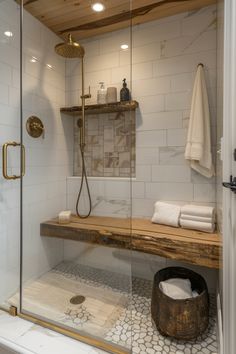 a walk in shower sitting next to a wooden shelf