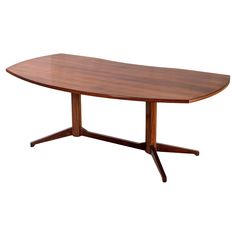 an oval wooden table with two legs and a curved top, on a white background