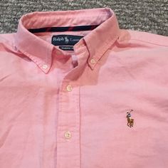 Ralph Lauren Men's Classic Fit Button Down, Salmon Color, Suit Shirt. 100% Cotton. Exclusive, Ralph Lauren Logo, Pearl Buttons Has A Very Soft Jean Material Feel To It, But Is 100% Cotton Lightweight Very Sophisticated Can Be Worn With A Nice Pair Of Khakis Or Jeans Can Be Dressed Up Or Down Brand New Worn Once Size Medium Classic Polo Shirt With Buttons And Casual Collar, Classic Polo Shirt With Casual Collar, Formal Short Sleeve Polo Shirt With Button Closure, Pink Button-up Dress Shirt, Casual Pink Button-up Dress Shirt, Classic Polo Shirt With Button Closure And Casual Collar, Pink Collared Casual Dress Shirt, Casual Pink Collared Dress Shirt, Casual Pink Cotton Dress Shirt