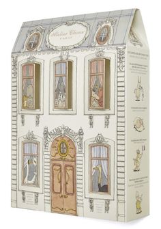 a cardboard box with an image of a doll house on the front and side of it