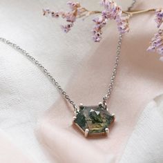 Be special with our moss agate necklace made in a delicate and minimalist style. Please choose the material and length from the drop down menu. In case if you prefer other shape or different gemstone - feel free to contact me, I will be happy to create custom hexagon shaped necklace.✨ Product details: Gemstone: Moss agate Measurements: 10x10mm Shape: Hexagon Material: 14k gold/Silver Total weight: 2.5g 🛠Handcrafted with love from our workshop in Prague.🛠 CERTIFICATION📃 Each piece of jewelry i Minimalist Pendant Necklace With Natural Inclusions, Green Octagon Necklaces As Gift, Green Octagon Necklace For Gift, Silver Hexagon Necklace For Jewelry Making, Hexagon Gemstone Necklace As A Gift, Hexagon Faceted Necklace For Gifts, Hexagon Faceted Necklace For Gift, Hexagonal Gemstone Necklace As Gift, Hexagon Gemstone Necklace For Gift