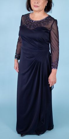 Feminine and classy. This is the perfect dress for mother of the brides or mother of the grooms. Elegant sequins and beads adorn the sleeves and neckline of this gown giving it that subtle wow factor. Brand: Alex Evenings Retail Price: $215 Color: Navy Blue Lined Hidden Zippered Back 100% Polyester Padded Model Info: Height: 5'0 Waist: 28'' Wearing a size US 6 Embellished Mother Of The Bride Dress With Fitted Bodice, Gown With Illusion Neckline For Mother Of The Bride, Illusion Neckline Gown For Mother Of The Bride, Mother Of The Bride Sequin Evening Dress, Gala Illusion Neckline Mother Of The Bride Dress, Elegant Embellished Long Sleeve Mother Of The Bride Dress, Embellished Fitted Bodice Floor-length Mother Of The Bride Dress, Sequined Floor-length Mother Of The Bride Dress, Fitted Sequin Mother Of The Bride Dress