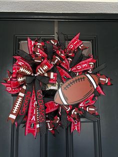 a football wreath is hanging on the front door