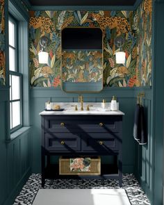 a bathroom with green walls and blue cabinets