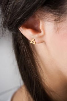 "\"Mini stud triangle earrings! Meet the \"Petites\", small, geometric earrings. These little ones are chic and so easy to wear all day long. A pretty gift for someone special! Don't forget, a cute little treat for yourself is always important!\" --Fairy Goldcharm ♥♥ CUSTOMIZATION ---> Available in yellow, white, and rose gold. ♥♥ DETAILS The triangle is 6.7mm x 6.7mm (approx. 0.26in x 0.26in). Earring backs included. ♥♥ MATERIALS All our items are made of 9 karats, 14 karats or 18 karats sol Triangle Stud Earrings, Triangle Earrings Stud, Gold Triangle, Mini Earrings, Triangle Studs, 18k Gold Earrings, Geometric Studs, Diamond Solitaire Necklace, Solitaire Necklaces