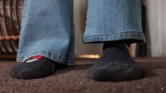 a person standing on top of a carpeted floor