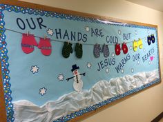 a bulletin board decorated with mittens and snowmen