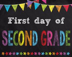 the first day of second grade written in colored chalk on a blackboard with bunting