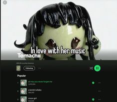 a web page with an image of a doll wearing black hair and text that reads, in love with her music