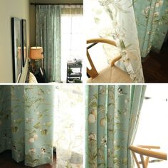 the curtains in this living room are blue and have white flowers on them with green leaves