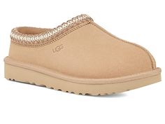 UGG Tasman - Women's Shoes : Driftwood : The Tasman always fits tight at first especially if someone has a high instep or high volume foot. It does stretch out over time. If you are in between sizes, please size up or down based on the volume of your foot and height of your instep. Take the suede UGG Tasman slip-on from weekday lounging to a Saturday excursion! Features a Tasman trim and a raw seam down the center with an embossed UGG logo at lateral side. Luxurious sheepskin lining for breathab Women’s Cute Shoes, Tasman Uggs Light Brown, Shoes To Ask For, Driftwood Tasman Uggs, Taxman’s Uggs, Christmas Wishlist Shoes, White Tasman Uggs, Uggs Slippers Tasman, Ugg Tasman Mustard Seed