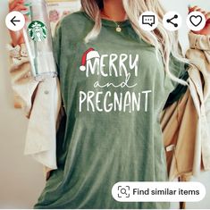 a woman wearing a green shirt with merry and pregannt on it's back