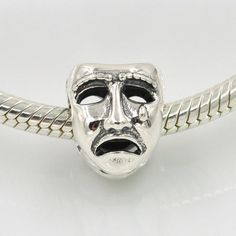 Theater Mask Charm To Be or Not to Be Beads Laugh Cry bead charm 100% 925 Sterling Silver fit for Authentic pandora and european bracelets Item specifics    Item Type: Beads    Fine or Fashion: Fashion    Item Weight: 3.29g    Outer Diameter: 12mm    Item Shape: Round-brilliant-shape    Model Number: STLW390    Material: Metal    Metals Type: Sterling Silver S925    Material: Authentic 100% Original 925 Sterling Silver    Style: Sterling Silver Jewelry Laugh/Cry Face beads    Usage: DIY Charm Br Silver Novelty Jewelry With Lobster Clasp, Novelty Sterling Silver Charm Jewelry, Novelty Sterling Silver Jewelry With Charms, Sterling Silver Round Beads Jewelry For Birthday, Adjustable Stamped 925 Jewelry For Birthday, Novelty Silver Jewelry For Birthday, Symbolic Silver Beads Jewelry Gift, Themed Silver Jewelry For Birthday Gift, Symbolic Silver Jewelry For Birthday Gift