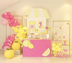 a lemon themed birthday party with pink and yellow decorations