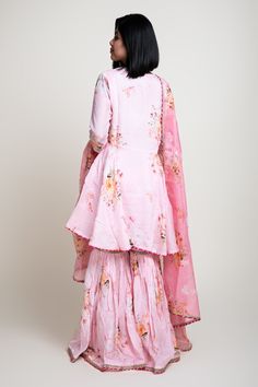 Pink digital floral print peplum kurta with embroidered detail. Paired with printed gharara and dupatta.
Component: 3
Pattern: Printed
Type Of Work: Digital print
Neckline: V neck
Sleeve Type: Three quarter
Fabric: Cotton silk, Chanderi
Color: Pink
Other Details: 
Gota work detail
Chanderi tassel dupatta
Occasion: Mehendi - Aza Fashions Tassel Dupatta, Floral Digital Print, Gota Work, Pink Cotton, Set For Women, Cotton Silk, Aza Fashion, Fabric Cotton, Silk Printing