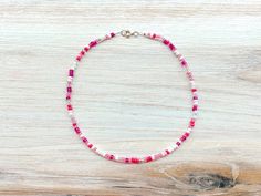 A pink seed bead choker necklace is perfect for any occasion or even wear it as casual everyday jewelry. This pink beaded choker is approx 16 inches in length. It's a cute accessory gift for her. This pink and white choker is made with high-quality glass seed beads.  I ship my items all 5 days a week, excluding holidays. Jewelry Care Instructions: No matter what materials are involved, jewelry is delicate. You should always remove your jewelry when working with your hands or engaging in activities that involve chemicals or abrasives. Take off your jewelry before any of the following: Swimming in water that has been treated with chlorine Cleaning your home Working in the garden Playing sports, especially contact sports Don't wear a lotion with jewelry Store jewelry pieces separately Caring Pink Choker With Colorful Beads For Gift, Summer Pink Choker As Gift, Dainty Pink Beaded Necklaces With Heart Beads, Dainty Pink Beaded Necklace With Heart Beads, Pink Beaded Choker For Gift, Pink Beaded Necklace With Tiny Beads For Gift, Adjustable Pink Beaded Choker, Adjustable Pink Colorful Beaded Choker, Adjustable Pink Choker With Colorful Beads