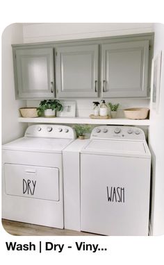 a white washer and dryer sitting in a kitchen next to eachother