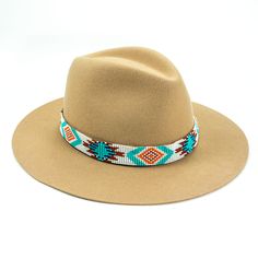 Price includes a Lola Sambboho hat & an Aztec Flat hatband. Save 10% with this bundle. Select hat size. Hatband is one size fits all. Hatband is removable. An iconic must-have Fedora hat that will never get out of fashion. Sambboho's Lola hat has a soft brim and indented crown. A chic piece to be worn at all seasons of the year. The timelessness chic and sophistication exuded by this hat make it a lifetime wardrobe investment you’ll never regret! Classic Fedora design in Sand color Trimmed with Weave Art, Beaded Hat Bands, Hat Bands, Beaded Hat, Huichol Art, Native American Beadwork, Bead Loom Bracelets, Winter Chic, Never Regret