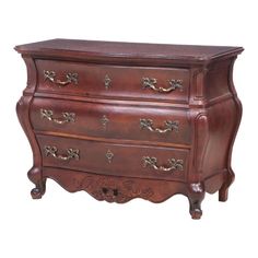 an old wooden dresser with ornate carvings on the top and bottom, against a white background