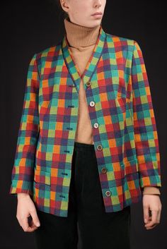 Colorful vintage blazer from the 1980s. Made from polyacrylic and modal (semi-synthetic fabric from beech tree pulb). In very good condition. Signs of wear are minor. Size 48 (XXL). The model is 175cm tall, usually wearing a size M. The blazer fits oversized.  Shoulders 44cm Chest 55cm Sleeve 59cm Length 70cm ... Discount for multiple items, applies automatically at check-out:  3 or 4 items: 15% Off 5 items or more : 25% off Also, please send me your ► phone number ◄ after ordering. That way you Vintage Multicolor Blazer For Fall, Vintage Multicolor Blazer For Spring, Retro Multicolor Blazer For Fall, Retro Multicolor Fall Blazer, Spring Vintage Multicolor Blazer, Retro Cotton Blazer, Retro Cotton Blazer With Button Closure, Retro Cotton Blazer For Fall, Retro Long Sleeve Cotton Blazer