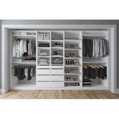 a walk in closet filled with lots of white drawers and clothes on top of shelves