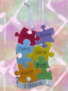 personalized puzzle piece christmas ornament with name on front and back pieces in different colors