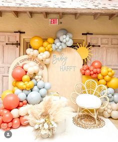 an outdoor event with balloons and decorations on the side of the building, including a sign that says baby hart