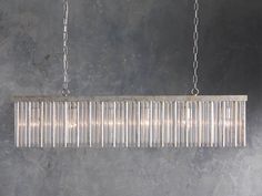 a chandelier hanging from a metal chain