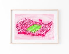 a drawing of a stadium with pink and green colors on it's walls, in front of a white wall