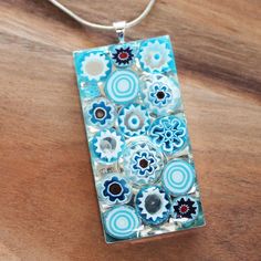 "These unique rectangle shaped pendants have been hand-crafted with genuine Italian Millefiori glass, where beautiful glass has been produced for centuries. The glass is set in a silver tray and sealed with high quality resin to produce an one of a kind pendant. Design: Italian Millefiori Glass Colour: Multiple Pendant Size: 5 x 3cm Chain Length: Choice of 16\" - 22\" silver plated snake chain" Modern Rectangular Glass Jewelry, Unique Rectangular Glass Jewelry, Rectangular Glass Jewelry For Gifts, Rectangular Glass Jewelry Gift, Handmade Clear Rectangular Jewelry, Handmade Rectangular Glass Jewelry, Micro Mosaic Jewelry, Glass Fusing Projects, Silver Trays