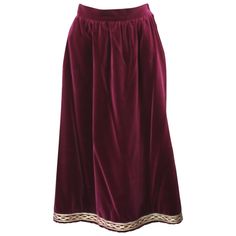 Yves Saint Laurent Russian Collection Skirt in a soft, silky wine cotton/rayon blend. Simply constructed with gathered waist and gold soutache embroidery along hem. Fully lined. YSL Rive Gauche. Side zip closure with 2 pockets. Waist 28", Hip 44", Length 31". Vintage Size 42. Soft 70/30 cotton/rayon blend. Soutache Embroidery, Russian Clothing, Midsize Outfits, Fantasy Wardrobe, Velvet Skirt, Russian Fashion, Rive Gauche, Perfect Wardrobe, Modern Dress