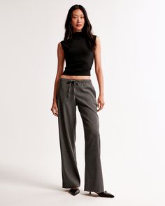 Mid rise, wide leg pants in our everyday menswear fabric, featuring functional pockets and a pull-on style elasticated waistband with a drawstring detail for comfort and adjustability. The body of this garment contains 66% recycled polyester. Menswear Women, Dressy Jeans, Womens Wide Leg Pants, Suits Coats, Pull On Pants, New Arrival Dress, Swimwear Accessories, American Apparel, Jacket Tops