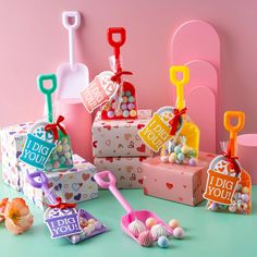 colorful gift boxes with candy in them on a table