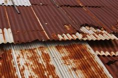 rusted corrugated roof with white and brown paint