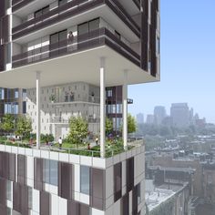 an apartment building with balconies and plants growing on the top floor, overlooking a cityscape