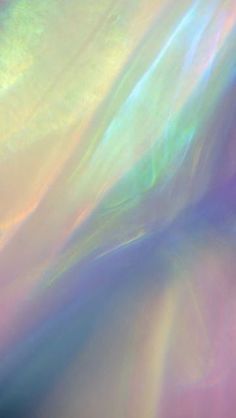 an abstract image of the sun shining through some colorful clouds and colors that appear to have been distorted