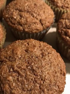 several muffins sitting on top of a white plate