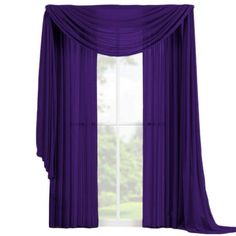 the purple curtains are hanging in front of a window